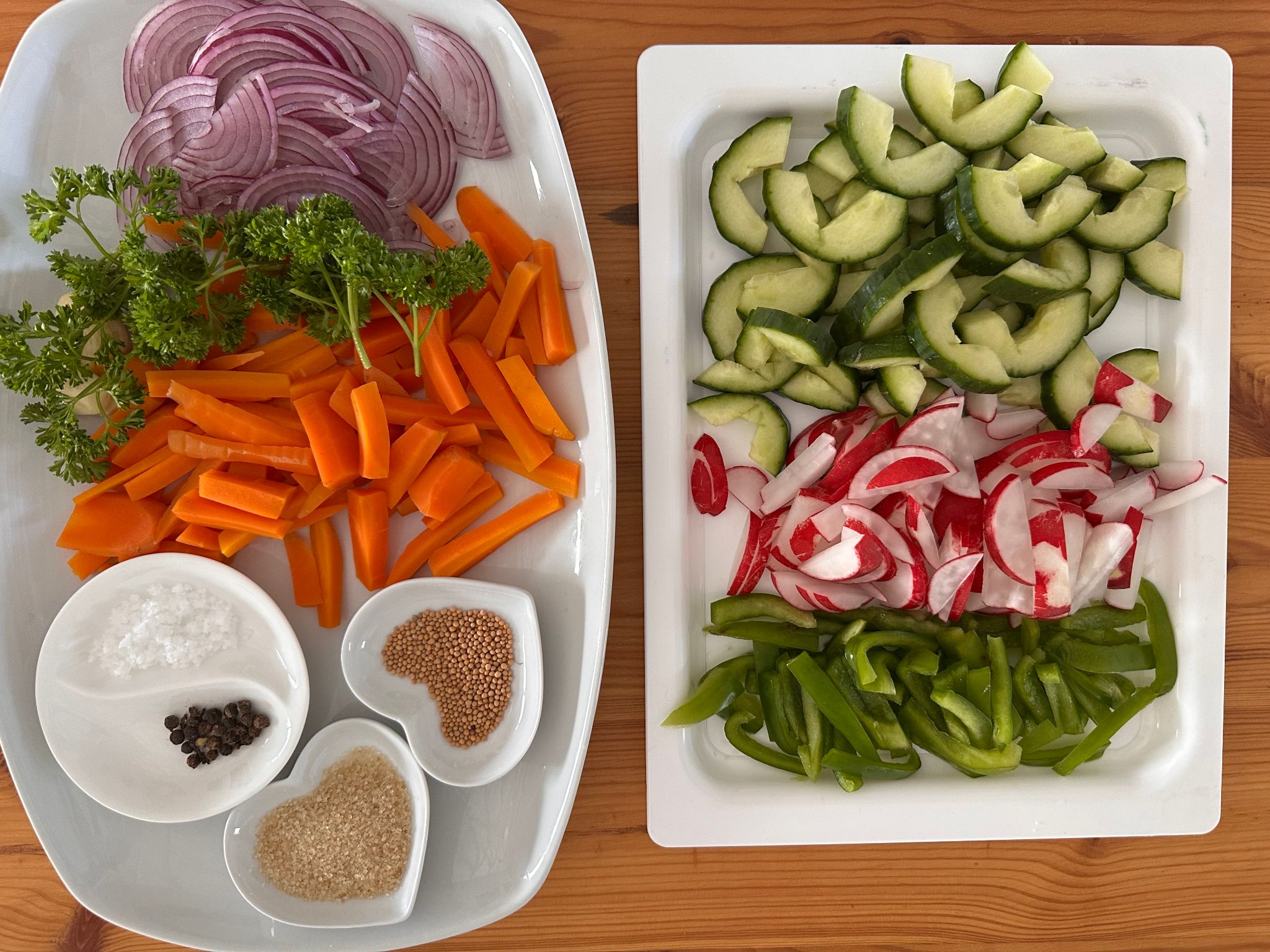Sliced onions, carrots, cucumber, radishes and peppers prepared for quick pickling